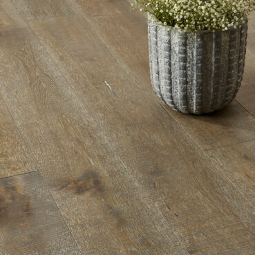 pot with florwers on oak floor