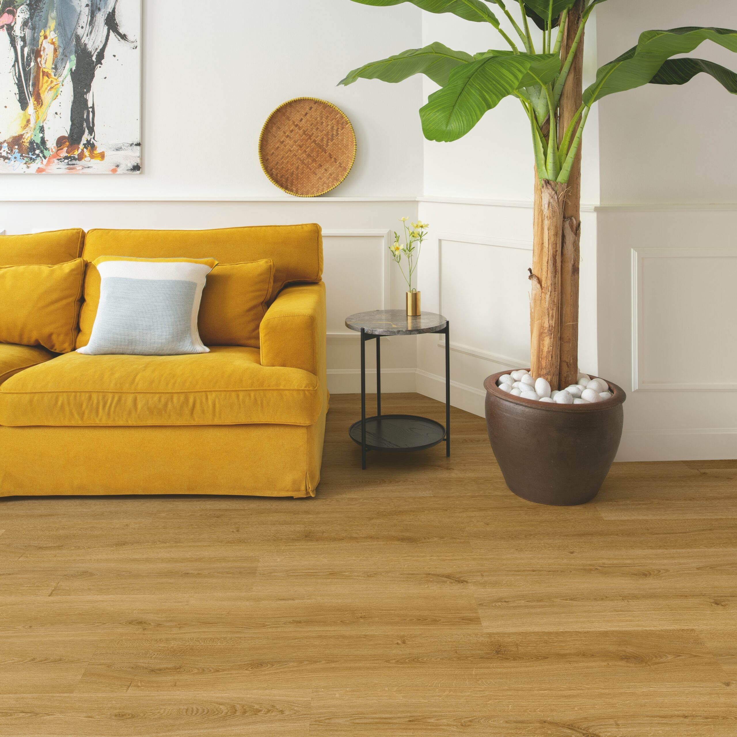 mustard yellow sofa with wood floor