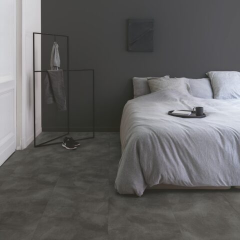 bedroom with dark flooring